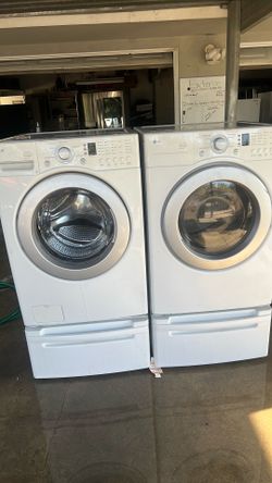 LG Washer and dryer with pedestals.