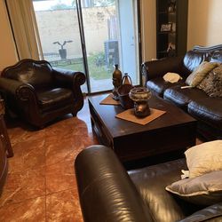 Dark brown leather sofa with armchair coffee table
