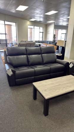 Reclining sofa and rocking reclining love seat with console