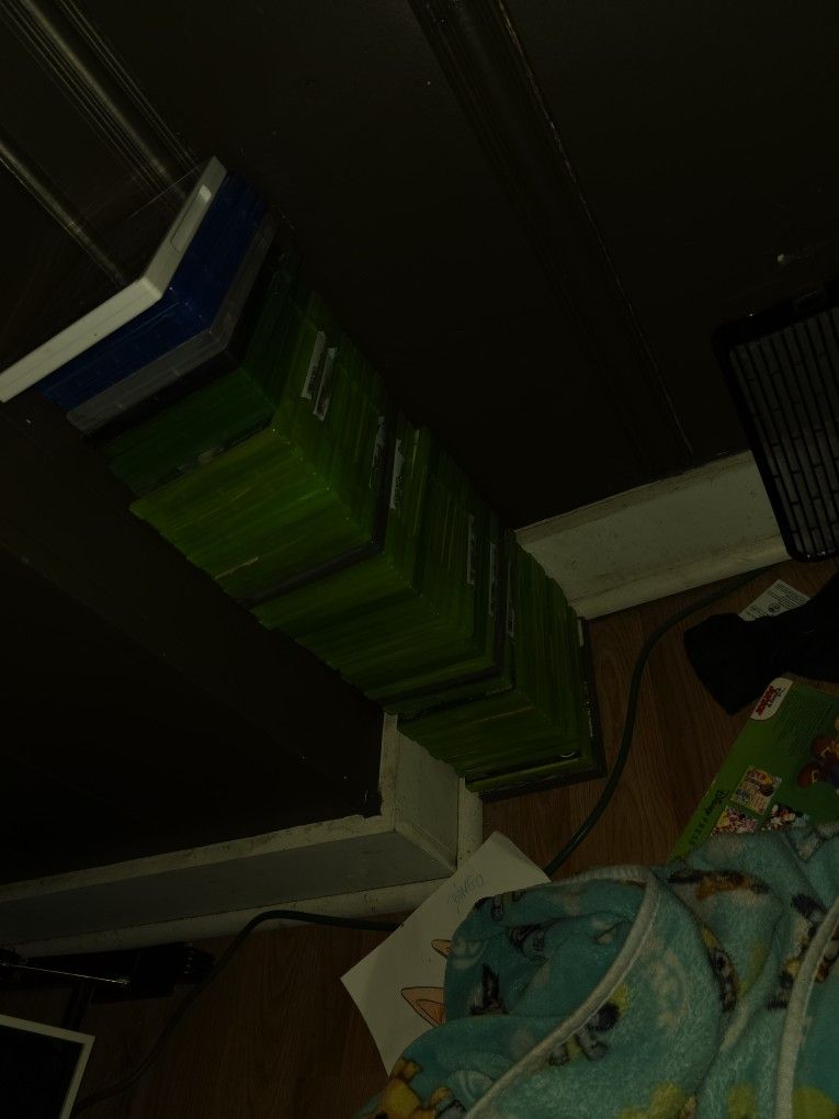 A Bunch Of Xbox 360 Games In Case With The Books Inside