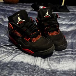Red Thunder Jordan 4s