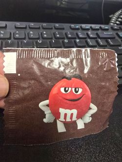 Unopened sealed empty M & M's wrapper