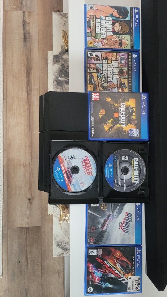 PS4 + 2 Controllers with Games