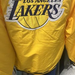 Los Angeles Lakers bomber jacket logo on front and back and sewed on patch on right arm multiple sizes small medium, large or extra large in men’s