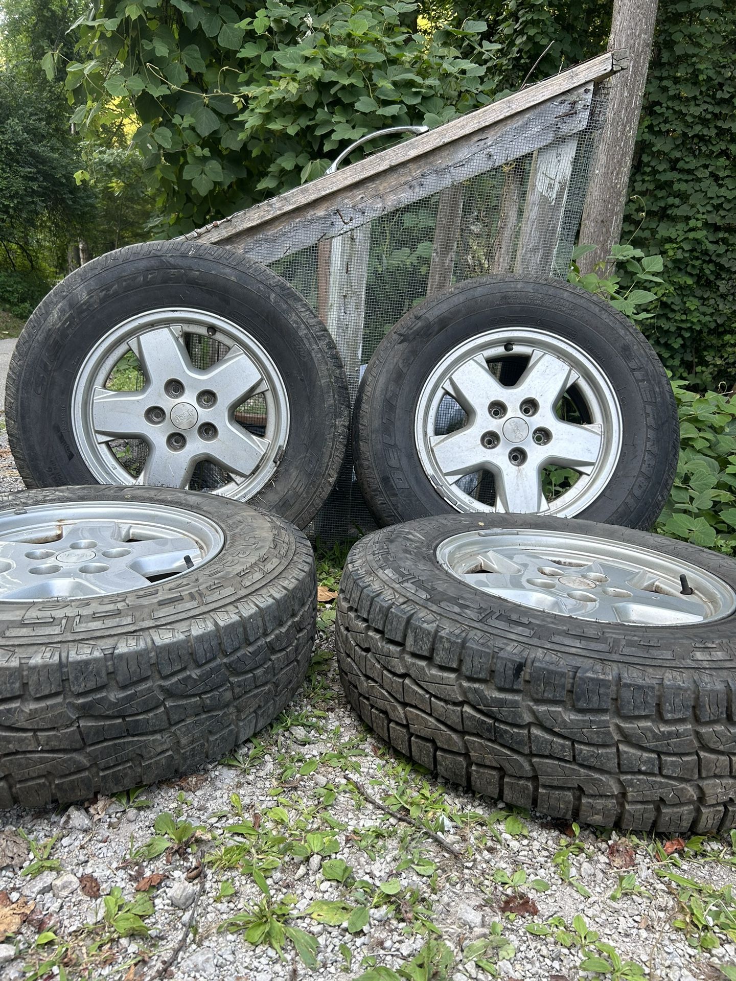 (4) Preowned Tires And Factory Jeep Rims 225/75R16