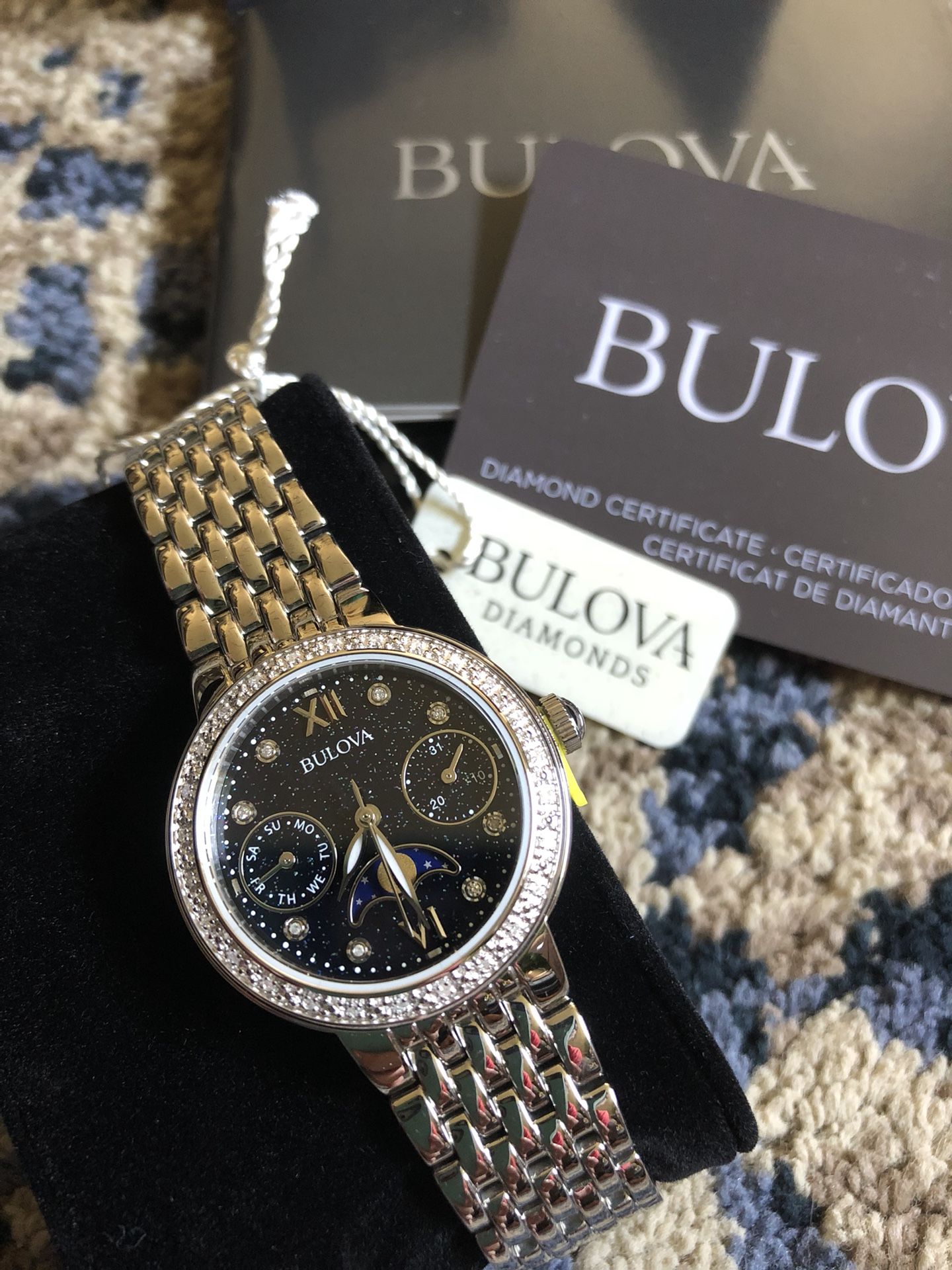 New in box Bulova 96R210 women’s Watch with moon phases and diamond certification. 34 diamonds hand set.