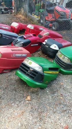 Riding mower hoods .