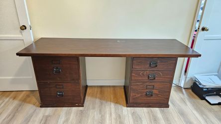 A Pottery Barn Bedford Executive Desk in an espresso/dark walnut wood finish