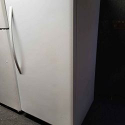 Freezer. Small fridge  China cabinet with  glass  shelves and light, Couch. End tables.