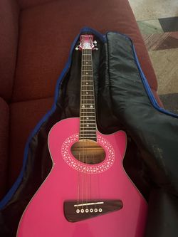 Pink guitar with cover