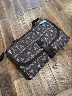 Portable diaper changing pad with wipes compartment and stroller straps
