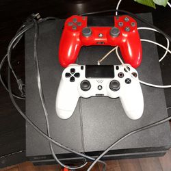 PS4 With 2 Remote Controls And 2 Games 