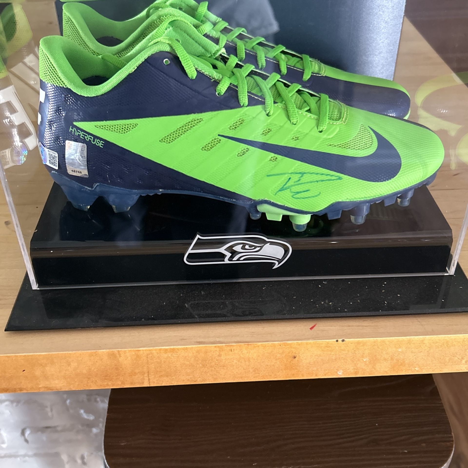 Russell Wilson Autographed Cleats With Display Case