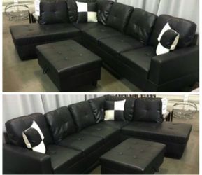 Black leather sectional couch and ottoman