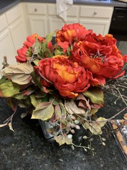 Flower arrangement dark orange flowers