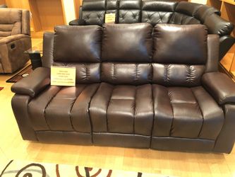 Dark brown leather reclining sofa and loveseat set