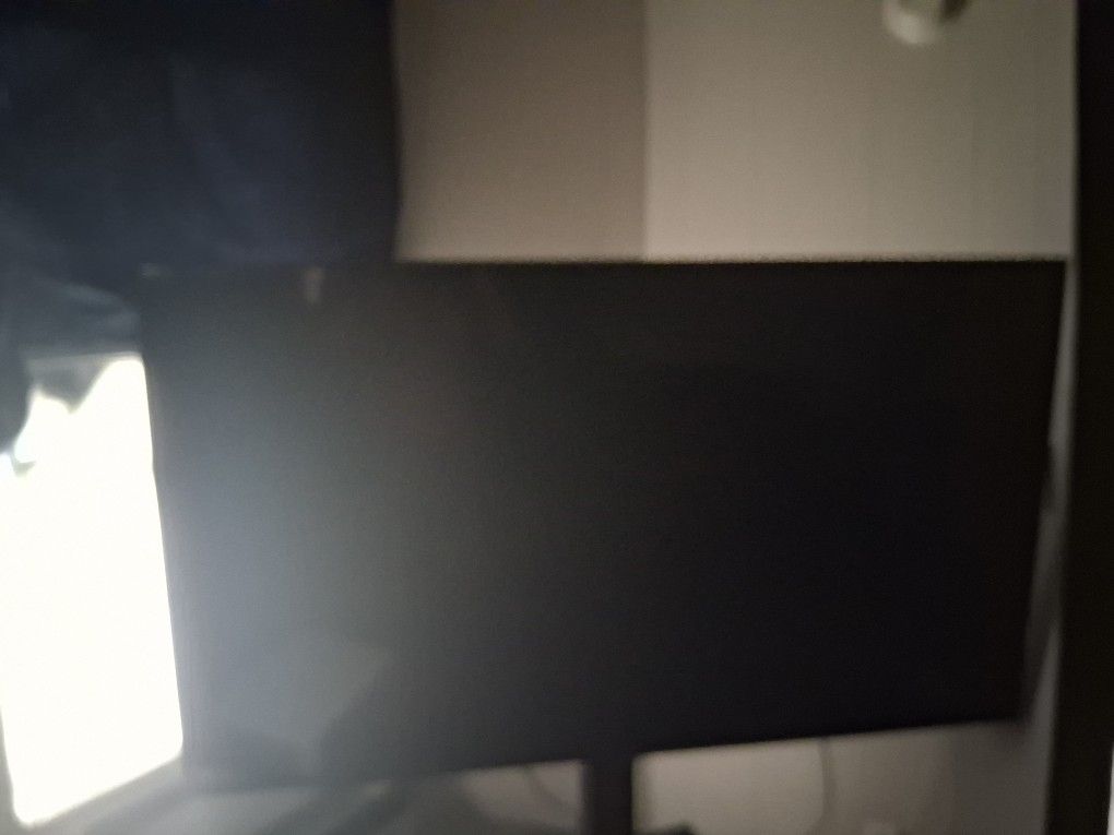 TCL 65 INCH ROKU TV ON SWIVEL STAND .