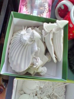 Delicate ceramic angels shells and different ornaments large angels are $8 ea others are $4 ea