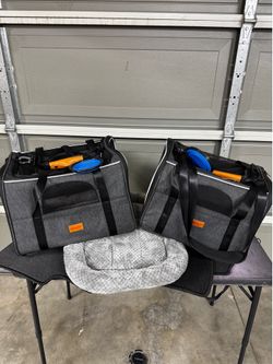2 small pet carriers