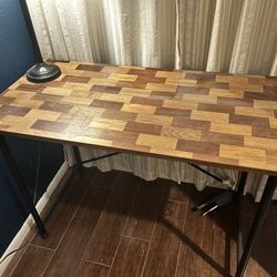 Wood patterned desk with black metal legs
