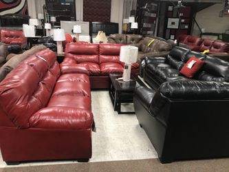 Ashley sofa and love seat with 3 pc tables and a rug