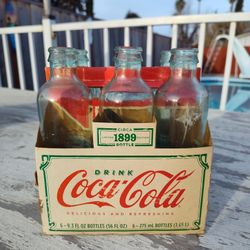 Six Pack Of Coke Bottles $10.