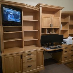 Custom built, solid wood bookcase and desk with storage.