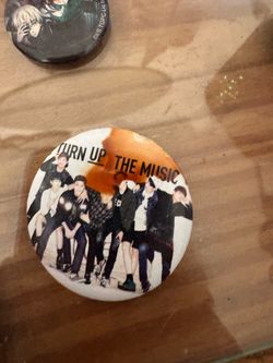 BTS pin from “TURN UP THE MUSIC.”