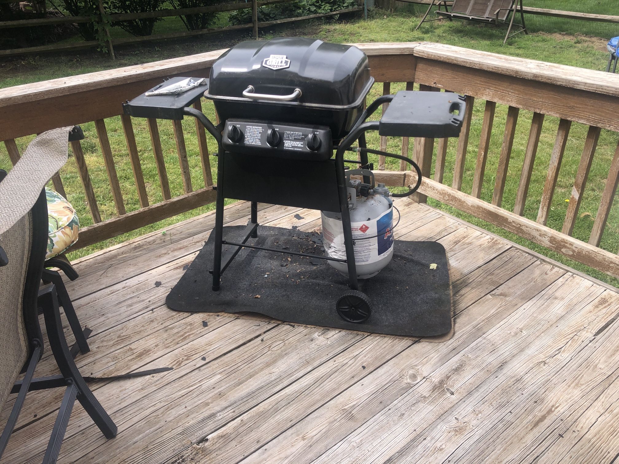 BBQ Grill and Propane Tank.