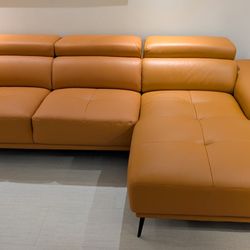 New Reversible Sectional.  Tangerine 🍊 Leather Match.  110x68x29H.  Free Delivery!