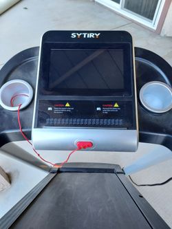 SYTIRY foldable treadmill featuring a built-in touch screen and WiFi