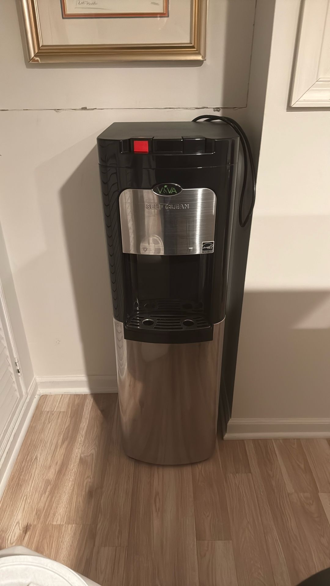Excellent condition, self cleaning, hot and cold water dispenser