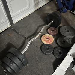 Curl bar with around 70lbs of weights