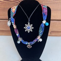 2 Necklaces Sun With Evil Eye And Tropical Charmed Necklace 