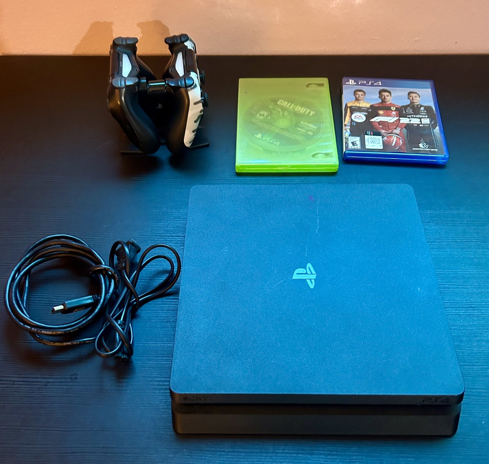 🔥 PS4 Slim + 2 Controllers + Games + Charging Station – Ready to Play! 🎮