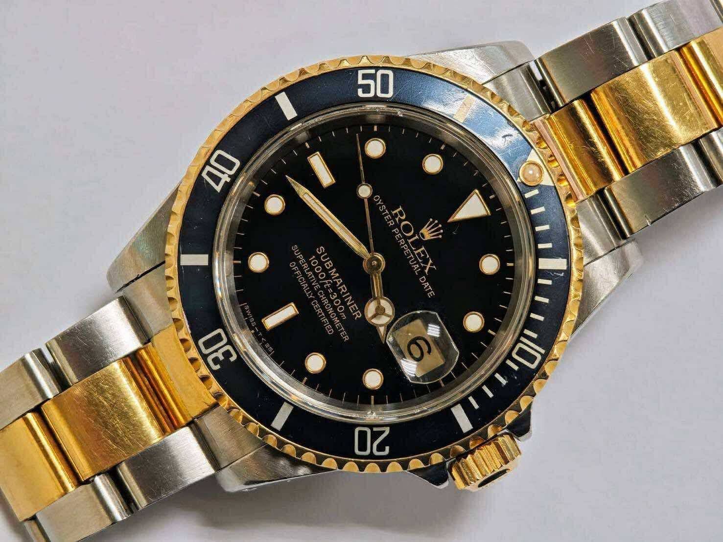 1991 Rolex Submariner Date 40mm 16613 Black dial Bezel 18k yellow gold & steel oyster box papers tags
