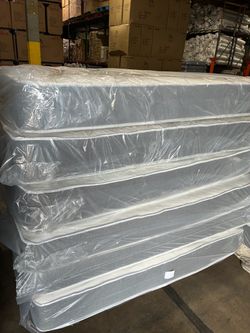 King regular mattress and box spring. In plastic new. Delivery free in Atlanta