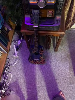 Kids flame guitar missing first string