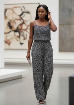 "Old Navy" Women's Size Medium Collection Black/White Spaghetti Strap Jumpsuit. The pictured Old Navy Smocked Cami Jumpsuit features a sleeveless prof