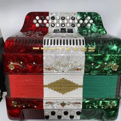(FBE) FA toned 34 button red/white/green 3 switch diatonic Rossetti brand accordion with straps.