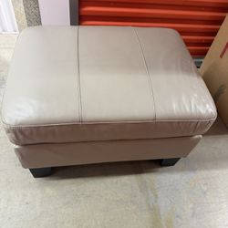 Three Person Beige Leather Couch And Ottoman