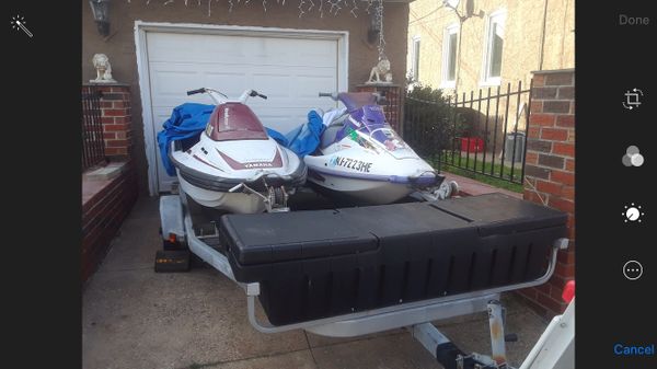 Two jetske’s with trailer