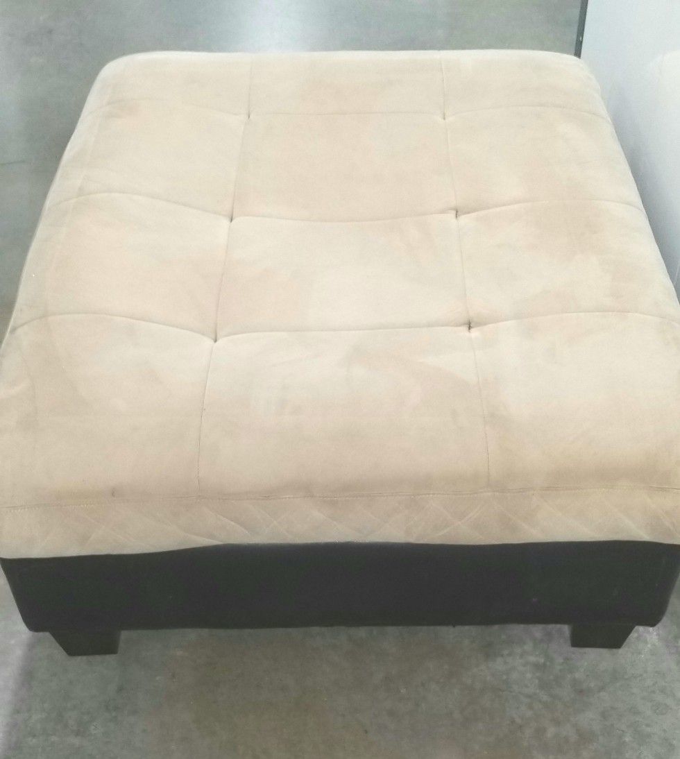 Suede ottoman with leather trim
