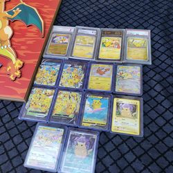 Pikachu Collection. Charizard picture frame is $200!. Black label Pikachu $1000. All for $1800 or best offer. Pikachu cards collection