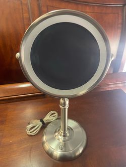 Double sided magnifying lighted mirror