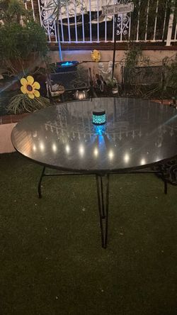 Metal and granite patio set