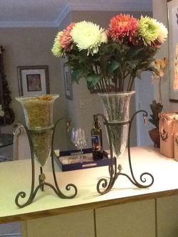 Glass vases in iron stand