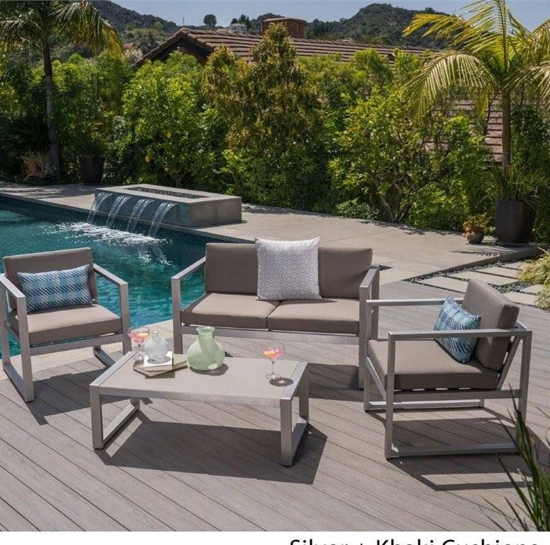 Outdoor patio couch with chairs and coffee table 