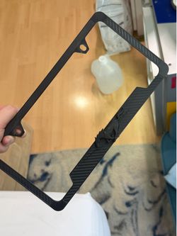 Black carbon fiber Mustang license plate cover