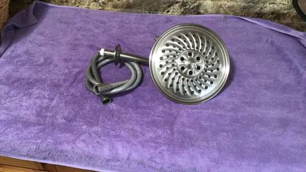 Brushed Nickel Shower Head with hose.